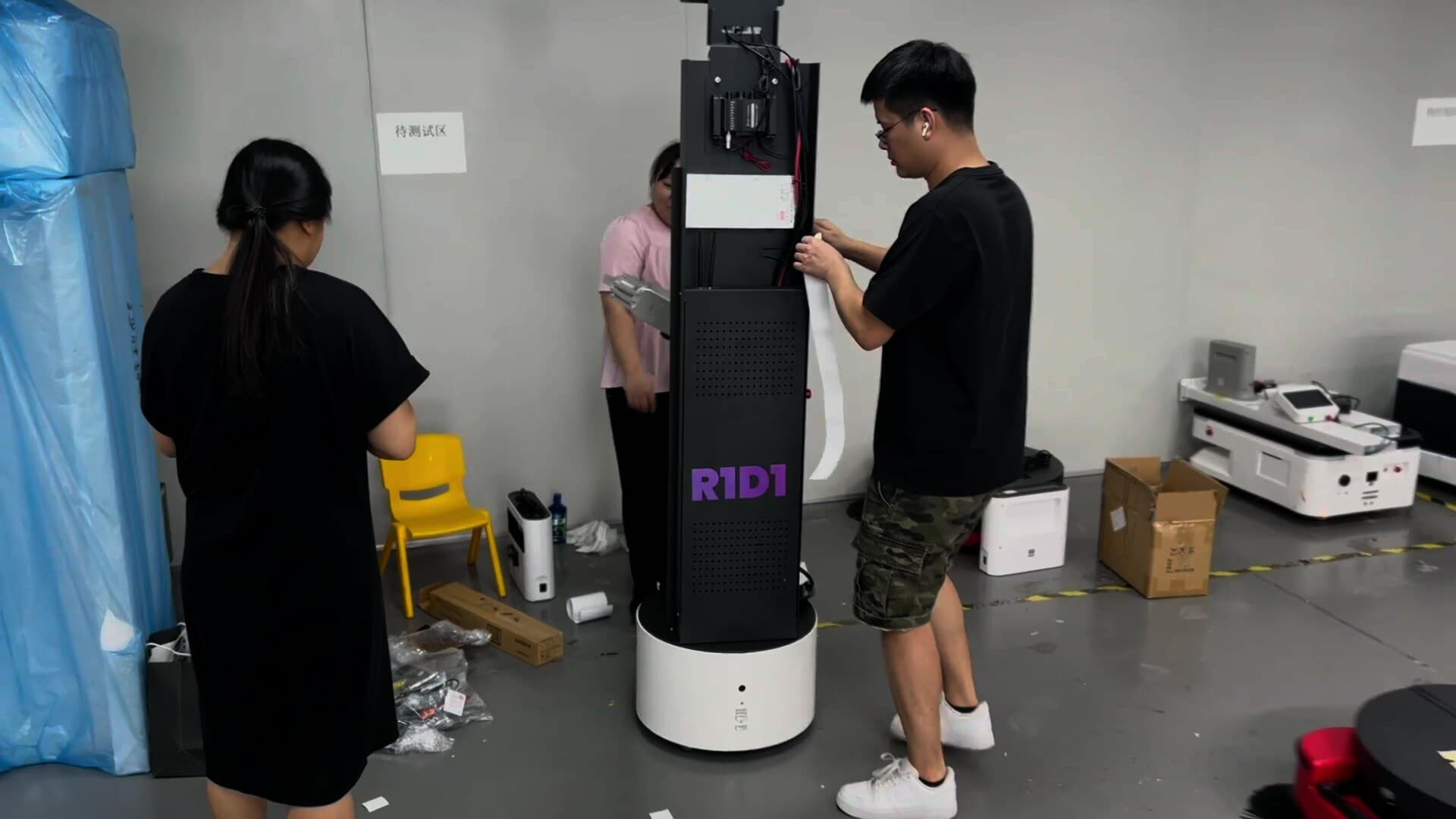 Students and faculty interacting with robots on a modern campus